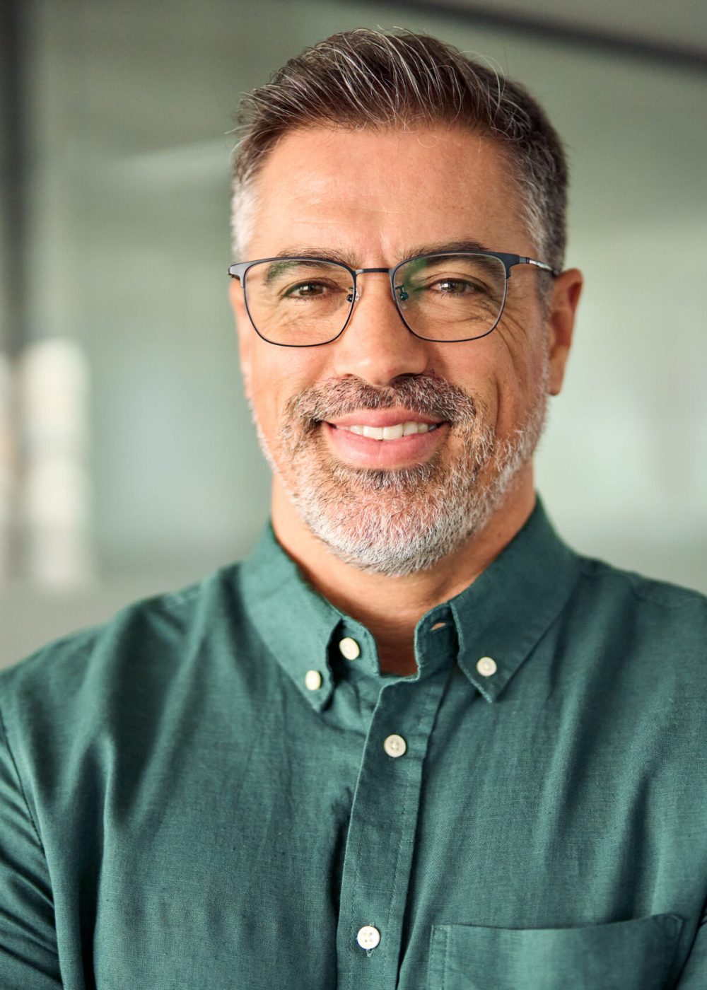 Smiling 45 years old banker, happy middle aged business man bank manager, mid adult professional businessman ceo executive in office, older mature entrepreneur wearing glasses, headshot portrait.